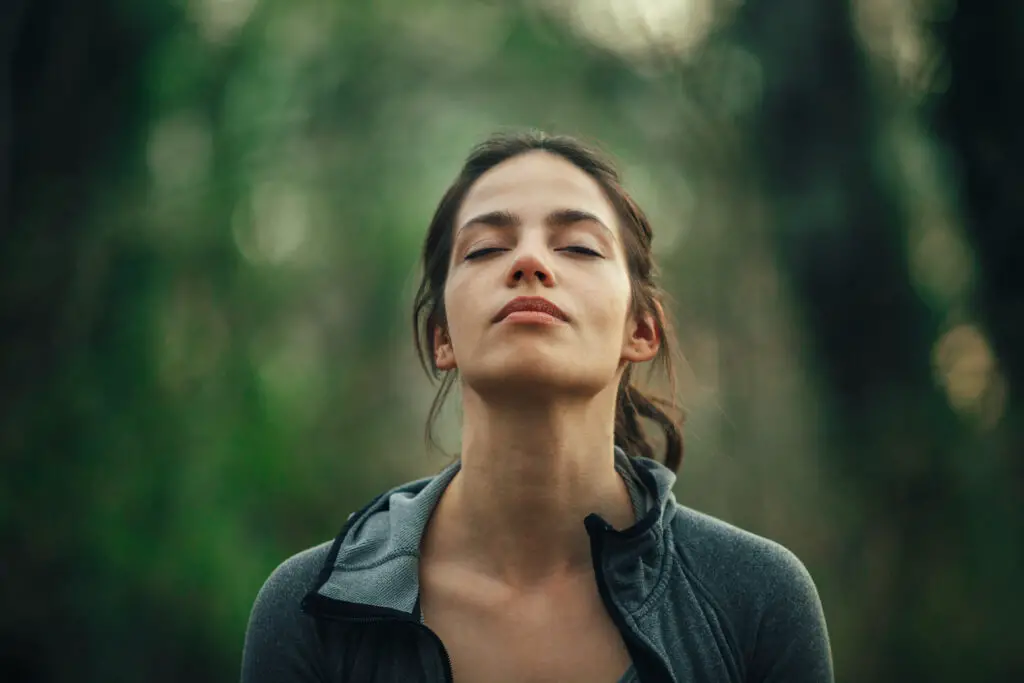 5 Unusual Meditation Techniques You Need to Try Woman in the forest breathing in meditation. Unusual meditation techniques.