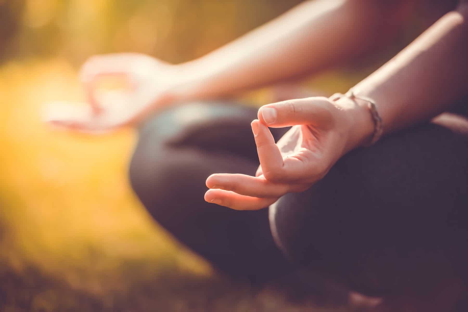 Person in meditation, with hands in the Chin or Gaya Mudra. How to do yoga meditation.